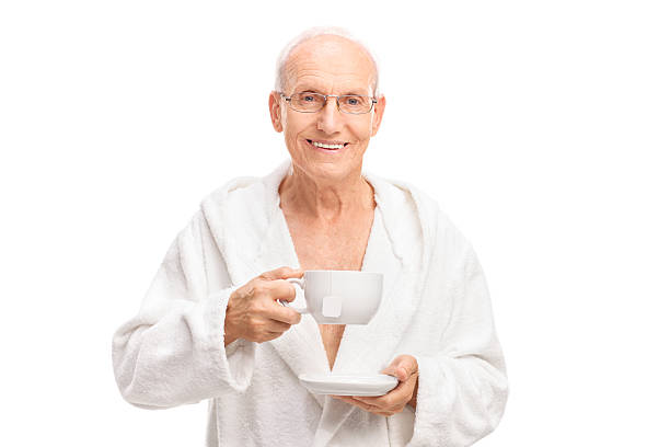 istock Cheerful senior holding a cup of tea 482140602