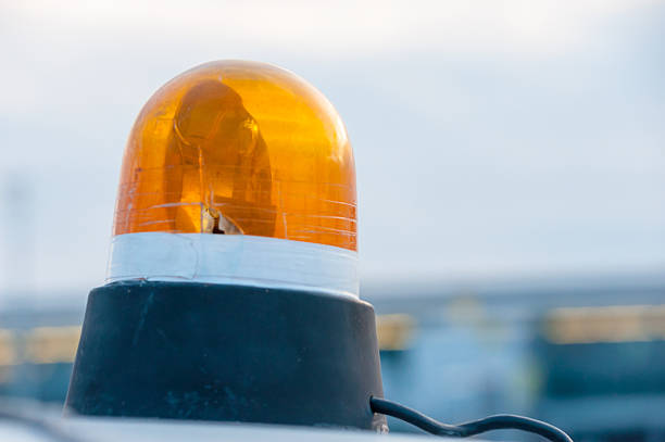 istock Orange flashing and revolving light on top of a support 482141164