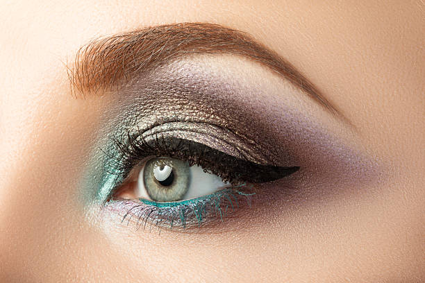 istock Close-up of woman's eye with creative modern make-up 482141366