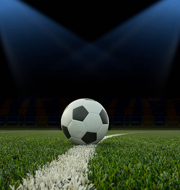 istock Soccer ball on the green field 482145718