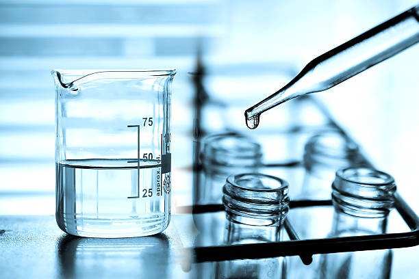 istock Dropping liquid to test tube 482146136