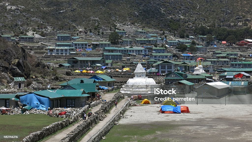 Scene in Khumjung after the recent earthquakes Mani wall and stupa in Khumjung. Village in the Everest Region. 2015 Stock Photo