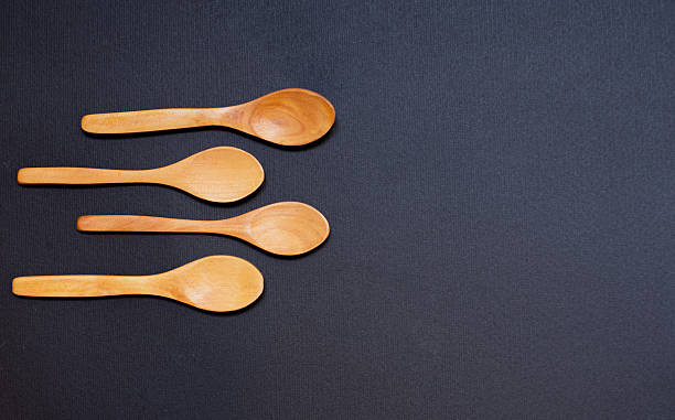 istock Wooden spoons on dark background 482150892