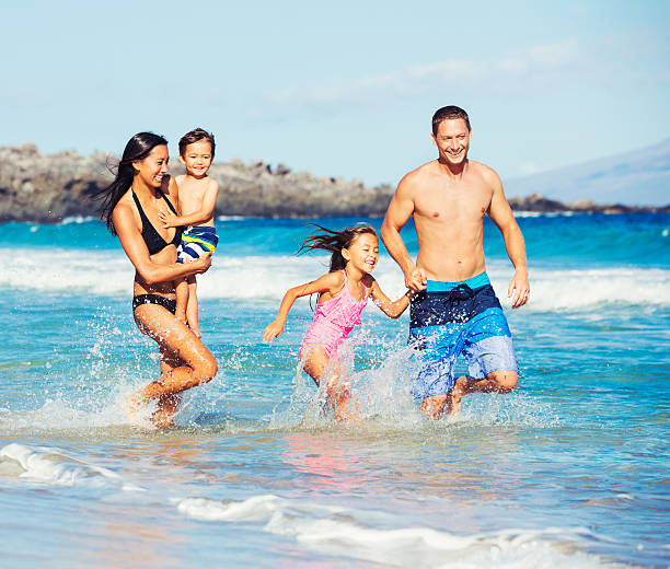 istock Happy Family Having Fun at the Beach 482151026