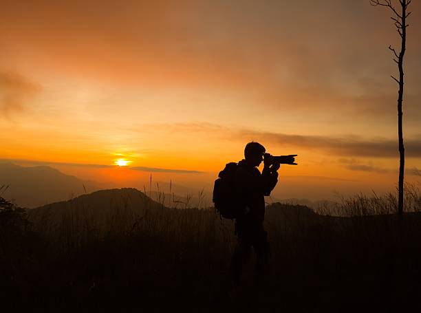 istock silhouette of photographer taking picture 482152270