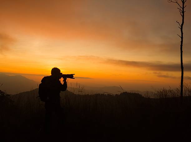 istock silhouette of photographer taking picture 482152282
