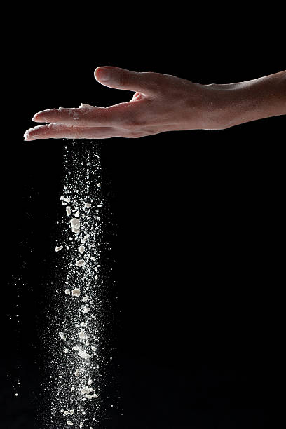 woman coating her hands in powder chalk magnesium