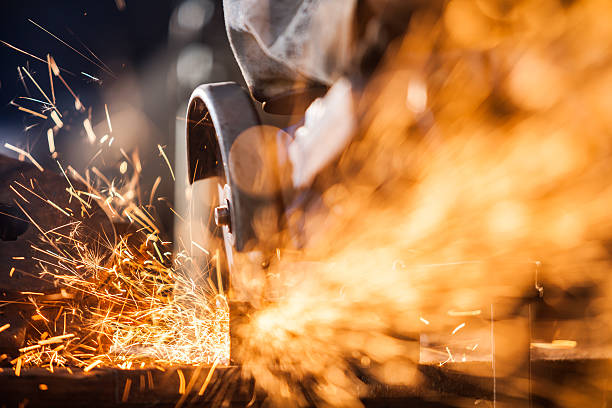 istock Close-up of worker cutting metal with grinder 482155056