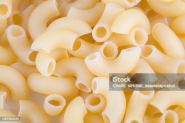 Macaroni Pasta Close Up Isolated On White Stock Photo - Download Image Now - 2015, Backgrounds, Bow Tie Pasta