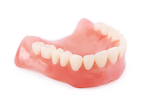 paar zähne, isoliert auf weißem hintergrund - laboratory dentures dental hygiene human teeth stock-fotos und bilder