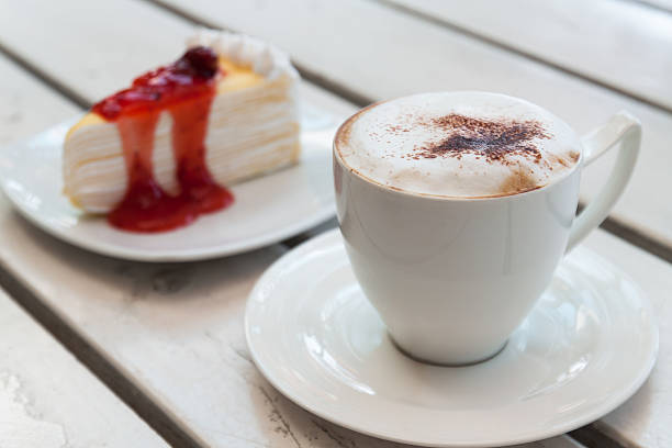 istock Cup of coffee with crepe cake 482156998