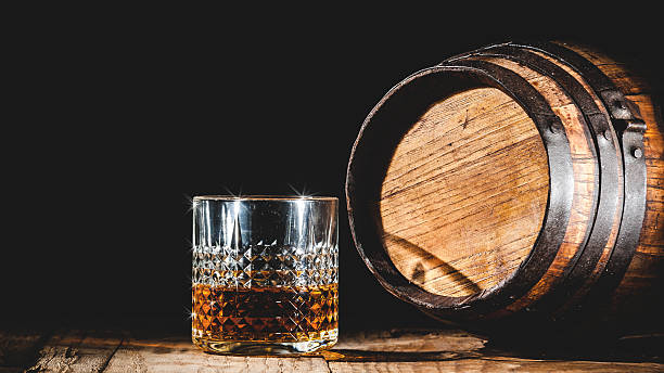 istock Strong alcohol on a wooden table and barrel 482159316