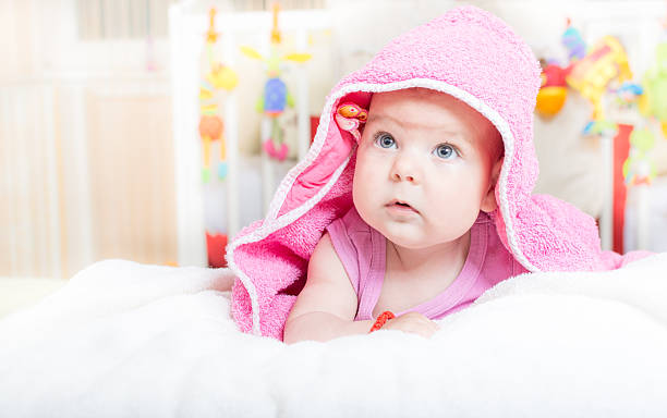 istock Cute baby lying on the bed after bath 482159744