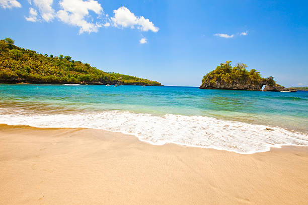 istock sandy beach on rocks at ocean. Indonesia, Bali 482163262