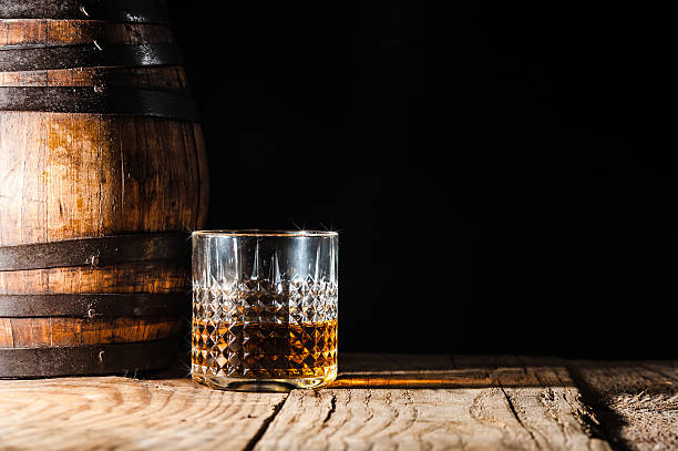 istock Strong alcohol on a wooden table and barrel 482166304