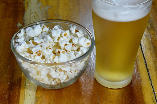 popcorn in bowl and beer