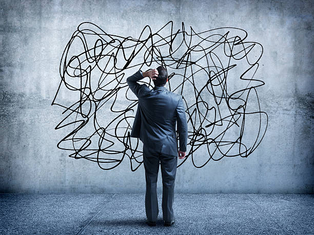 istock Confused Businessman Staring At Scribble On A Wall 482166940
