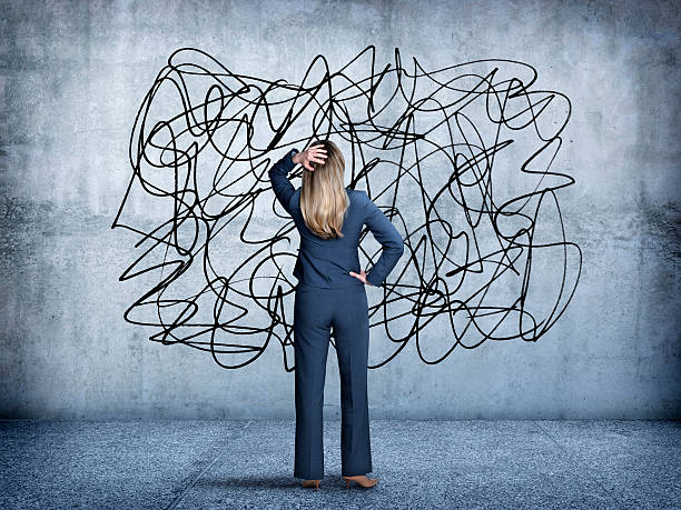 istock Confused Businesswoman Staring At Scribble On A Wall 482166944