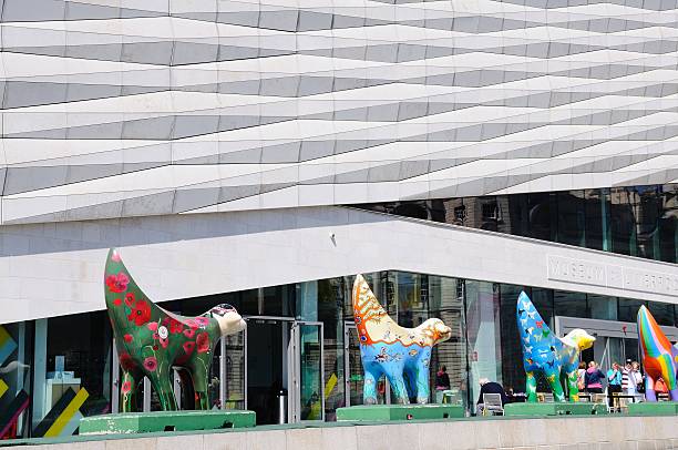 Museum of Liverpool building. Liverpool, United Kingdom - June 11, 2015: The Museum of Liverpool building at Pier Head with four Superlambananas in the foreground and people passing by, Liverpool, Merseyside, England, UK, Western Europe. superlambanana sculpture in liverpool stock pictures, royalty-free photos & images