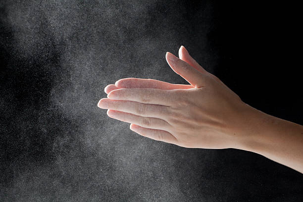 istock woman coating her hands in powder chalk magnesium 482177176