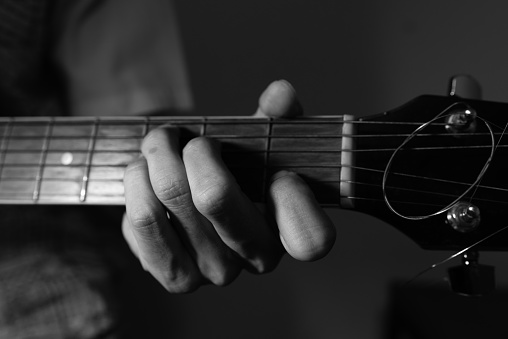 Black and White Photo of A Guy Playing Guitar in Key C Major