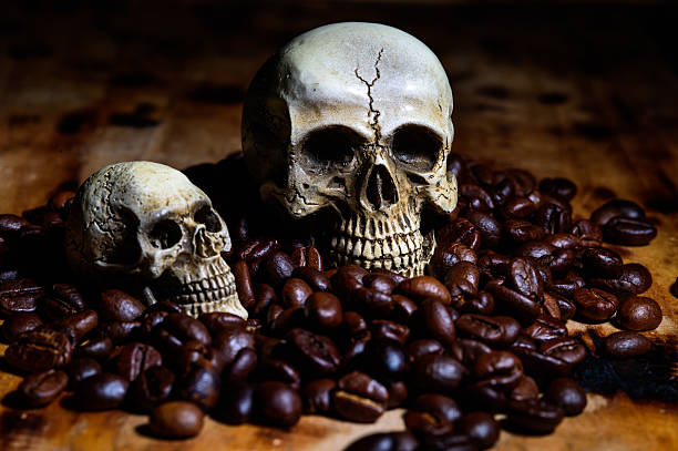 istock close up Human Skull with coffee beans 482180306