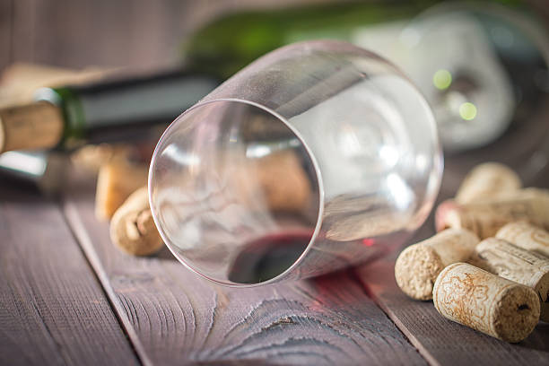 istock Bottle of red wine, glass, corks and corkscrew 482180902