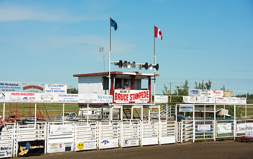 Bruce, Canada - July 24, 2015: Shoots and booth for the Bruce Stampede rodeo. The people in the booth are announcing participants and events in the 102nd year of this rodeo.