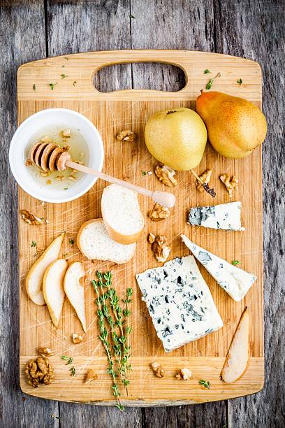 istock Blue cheese with pear, nuts and honey top view 482189514