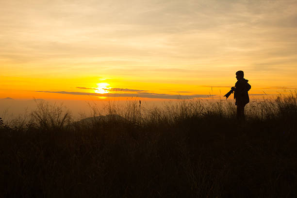 istock silhouette of photographer taking picture 482191122