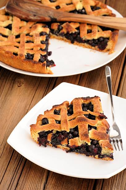 istock Homemade lattice pie with whole wild blueberries cut 482194628
