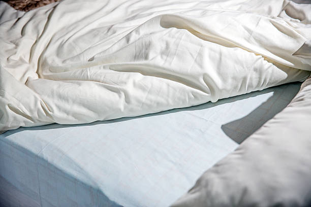 istock Unmade bed that's been slept in 482198354