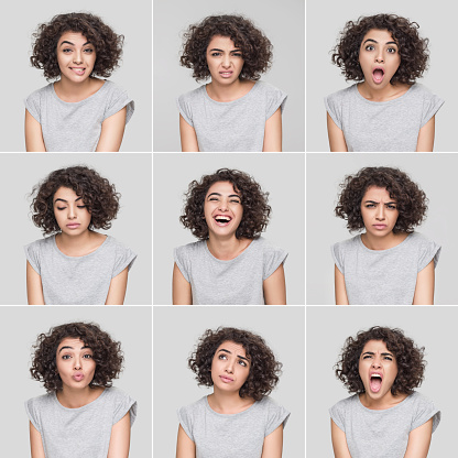 Mujer joven haciendo nueve diferentes expresiones faciales photo