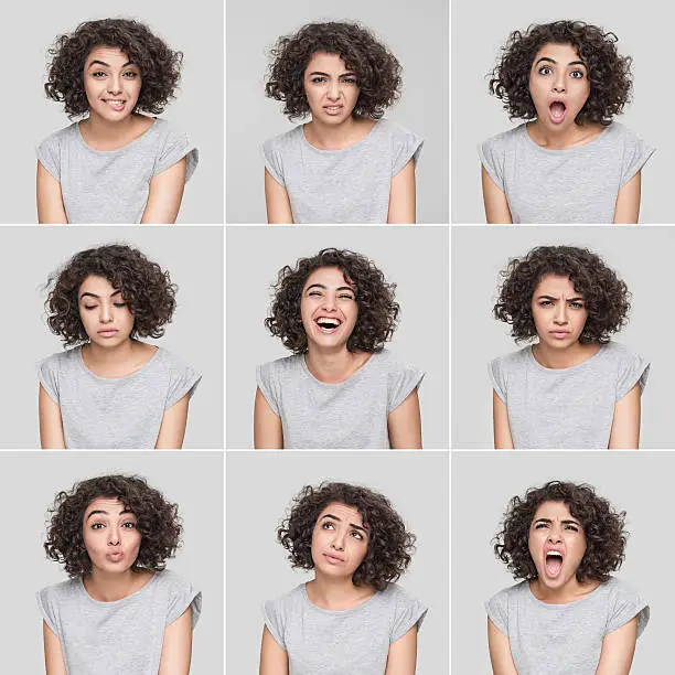 Photo of Young woman making nine different facial expressions