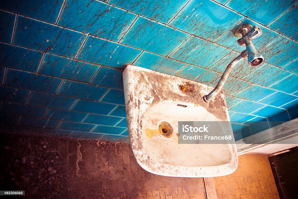 Old sink in a public abandoned restroom Old sink in a public abandoned restroom - toned image 2015 Stock Photo