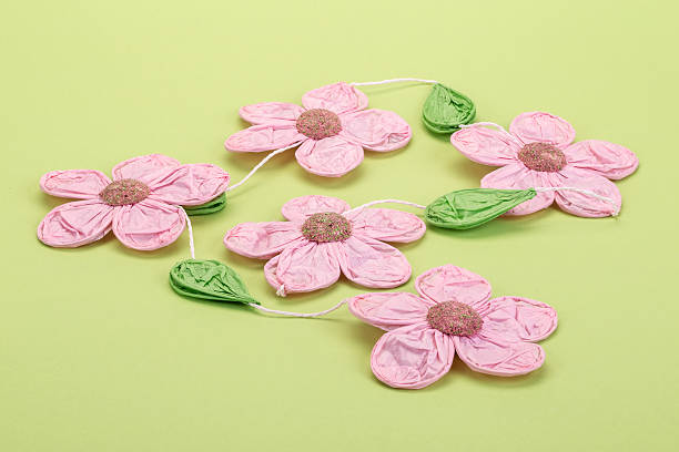 istock pink paper flowers 482206454