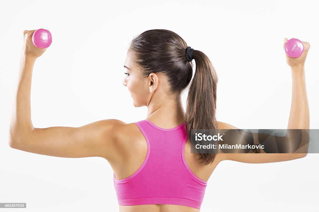 Femme de remise en forme, soulever des poids et haltères - Photo de 20-24 ans libre de droits