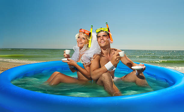 Newly-married couple enjoying on the beach
