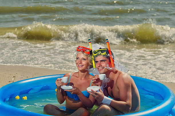 istock Newly-married couple enjoying on the beach 482208517