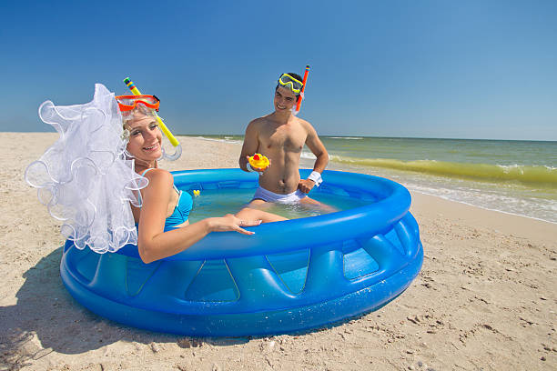 istock Newly-married couple enjoying on the beach 482208533