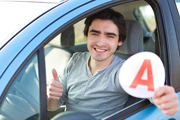 istock Young man happy to get his driving license 482213041