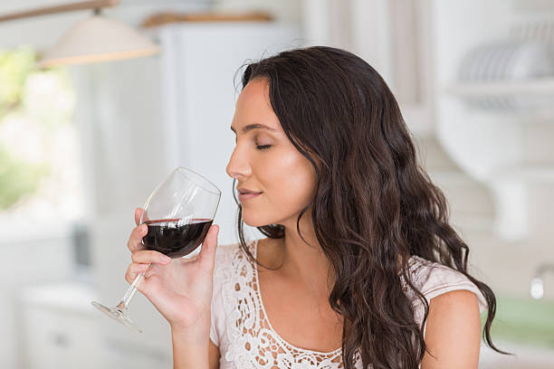 istock Pretty brunette having a glass of wine 482215202