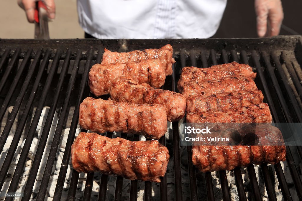 Delicious  sausages on the barbecue grill. Selective focus. 2015 Stock Photo