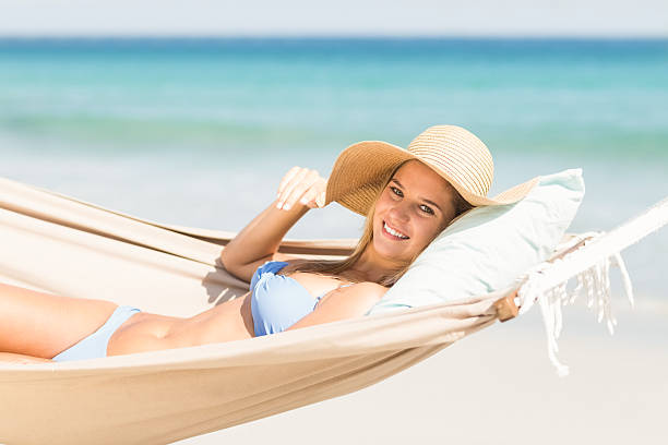 istock Pretty woman relaxing in the hammock 482221588