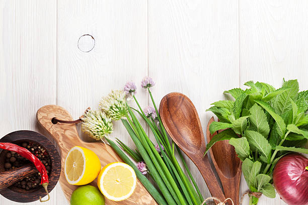 istock Fresh herbs and spices on wooden table 482221612