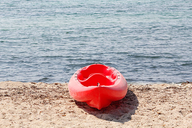 istock Red kayak in the beach 482222268