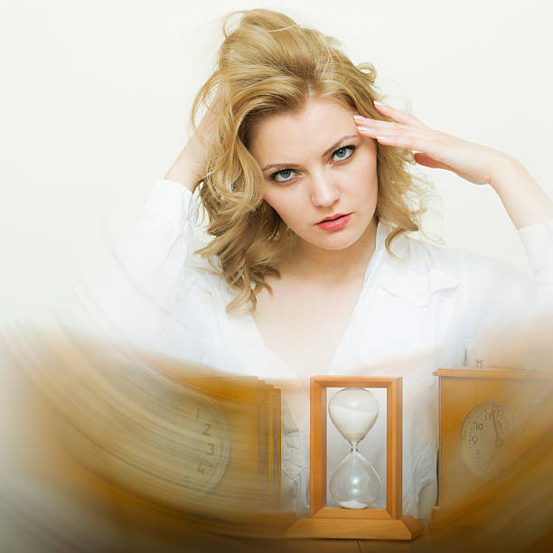 istock Waiting woman with sand glass 482231854