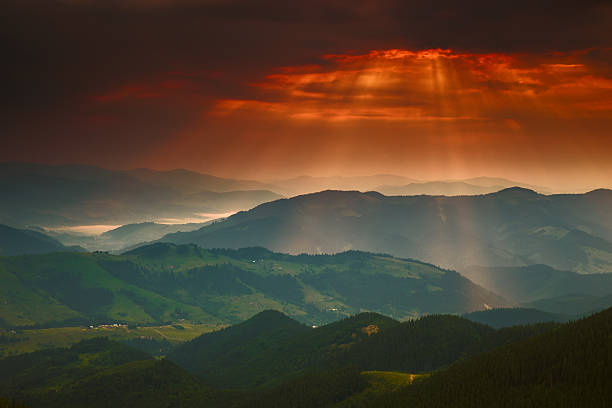 istock Dramatic golden sunset sky with sun and mountain Carpathians 482236846
