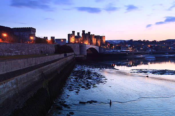 Conwy Castle Conwy castle at dusk in north Wales UK conwy castle stock pictures, royalty-free photos & images