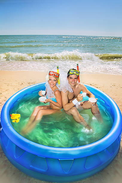 istock Newly-married couple enjoying on the beach 482244507